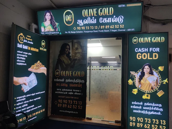 Olive Gold Pondy Bazaar Flagship Entrance and illuminated signboard