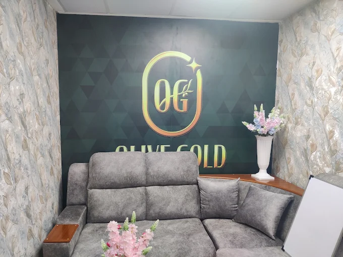 Olive Gold VIP Customer Consultation Lounge with plush sofa and brand backdrop